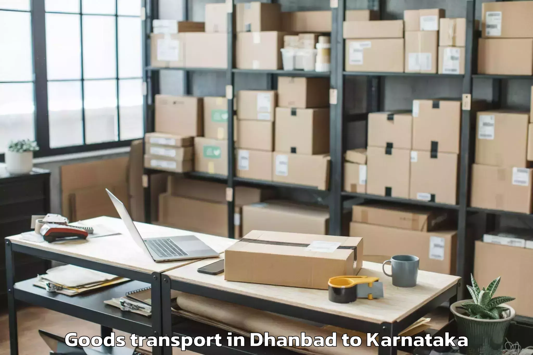 Reliable Dhanbad to Karnataka State Law University Goods Transport